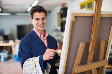 Male artist drawing in studio