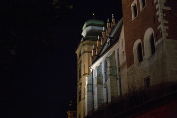 buildings in Krakow at night by the light of lanterns
