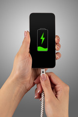 Elegant hand charging cellphone with low battery

