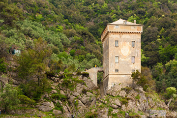 Fototapeta na wymiar The old tower on the Ligurian coast in Italy