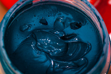 blue gouache in a jar macro close-up