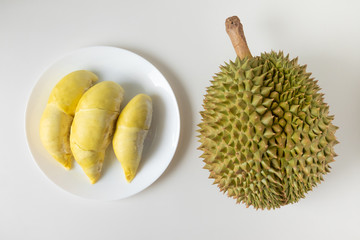 Top view of fresh cut Durian and pulp of Durian yellow color on dish isolated on white background