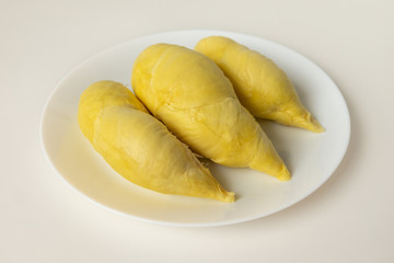 Top view of fresh pulp of Durian yellow color on dish isolated on white background