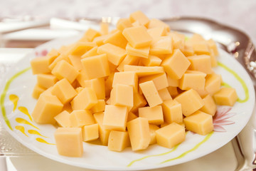 cheese diced on a plate close