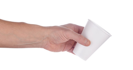 Hand holds out white plastic cup