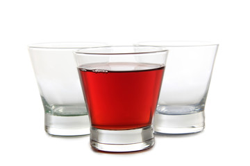 Glass jars with colorful cocktails on a white background