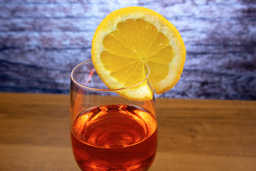 Cocktail Aperol Spritz in a glass for red wine with an orange slice