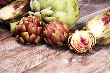 Obraz premium artichokes on grey background. fresh organic artichoke flower vegetable