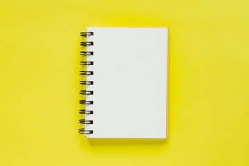 Clean note book for goals and resolutions. mockup for your design. Spiral note book on yellow...