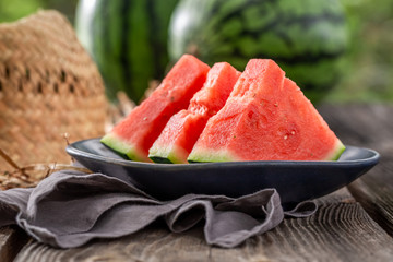 Juicy and tasty watermelon in summer garden