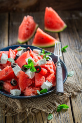 Sweet watermelon salad with feta cheese and black olives