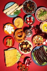 Middle eastern or arabic dishes and assorted meze, concrete rustic background. Falafel. Turkish Dessert Baklava with pistachio. Halal food. Lebanese cuisine