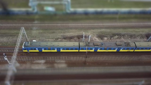Aerial of Electric Passenger Trains on Multiple Tracks Railway Tilt-Shift