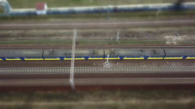Aerial of Electric Passenger Trains on Multiple Tracks Railway Tilt-Shift