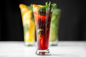 Pomegranate cocktail with mint in a glass goblet. The range of drinks. Concept for drinks, summer, heat, alcohol, party and bar