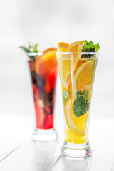 Refreshments from mint and citrus on a white background. Concept for drinks, summer, heat, alcohol, party and bar