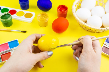 Girl paints eggs