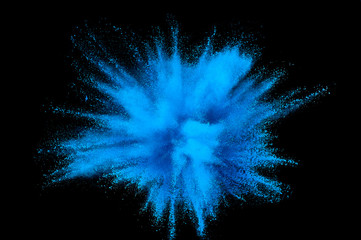 Colored powder explosion. Abstract closeup dust on backdrop. Colorful explode. Paint holi