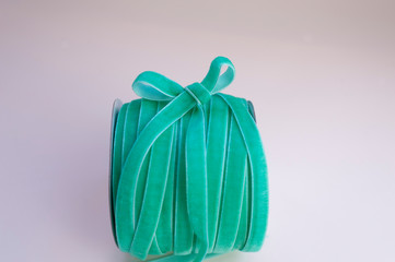 a skein of velvet green ribbon for floristics and gift wrapping with a cute bow on the side