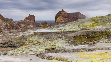 A landscape view across the Lahar and landslip area towards the helicopter landing area near the abandoned wharf on the active Volcano "White Island, New Zealand.