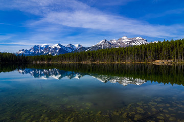 Hebert Lake with snow capped mountain with reflection, Banff National Park, Alberta, Canada