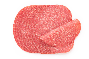 Salami slices on white background.