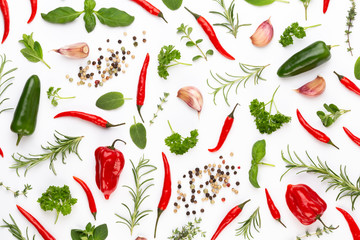 Spice herbal leaves and chili pepper on white background. Vegetables pattern. Floral and vegetables on white background. Top view, flat lay.