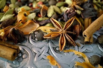 Mixed spices close up on old metal plate