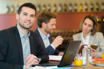 young businessman working during lunch time and working on laptop