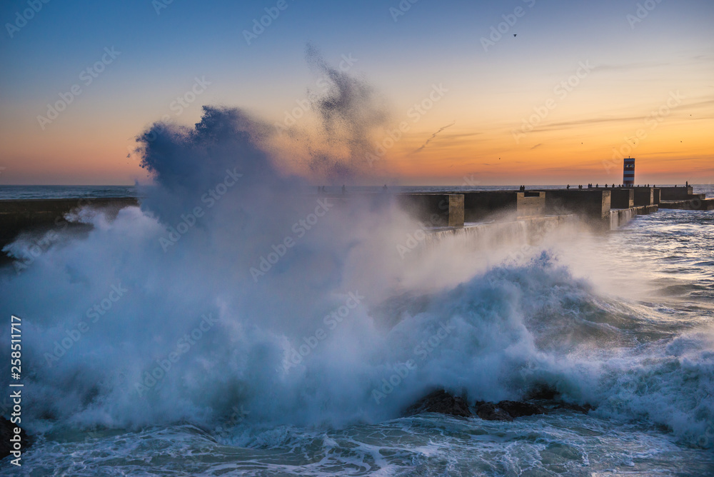 Sticker Large waves on Atlantic Ocean during sunset in Porto, Portugal