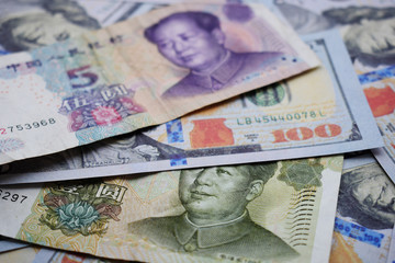 American dollars and Chinese yuan, the background of the money.
