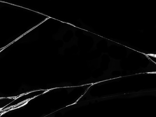 Cracked glass texture on black background. Isolated realistic cracked glass effect.
