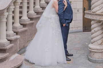 Fototapeta na wymiar bride and groom together on the stairs