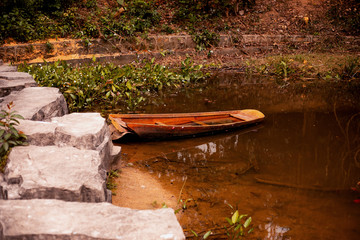 flooded old wooden boat on the lake