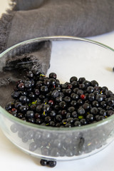 whortleberry (blueberry) in a glass bowl on a white background