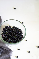 whortleberry (blueberry) in a glass bowl on a white background