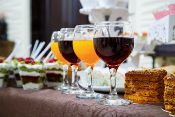 glass goblets with red and orange juice