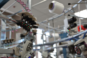 Automatic line for sewing clothes from synthetic and knitted fabrics