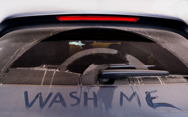 Wash me words on dirty rear car window  - 258520729