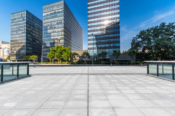 Panoramic skyline and modern business office buildings with empty road,empty concrete square floor