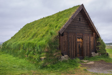Fototapeta na wymiar Thorlaksbud turf building next to Cathedral in Skalholt village in Iceland