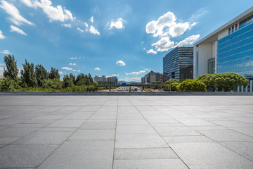 Panoramic skyline and modern business office buildings with empty road,empty concrete square floor