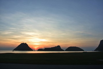 The most romantic sunrise.Silhouette sea mountains and sun
