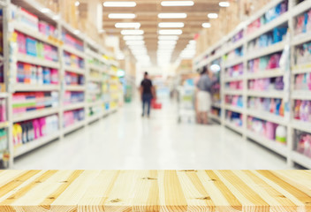 Supermarket or retail store blur background. That is a self-service shop offer grocery and variety of food, beverage and household product on shelf or rack. For shopping background or product display.