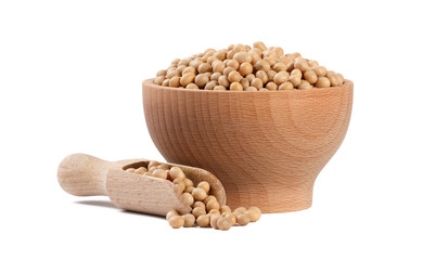 soy bean in wooden bowl and scoop isolated on white background. nutrition. food ingredient.