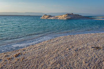 Dead Sea salt lake shore with so called rock salt in Jordan