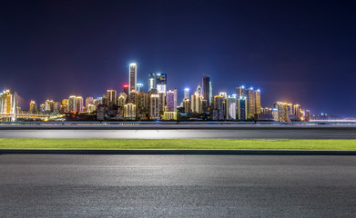 Obraz premium Panoramic skyline and modern business office buildings with empty road,empty concrete square floor