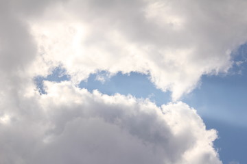 White clouds against the blue sky.