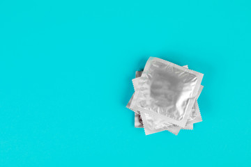 Obraz premium Condom on a blue background. The concept of safe sex.
