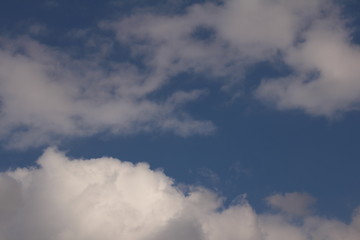 White clouds against the blue sky.